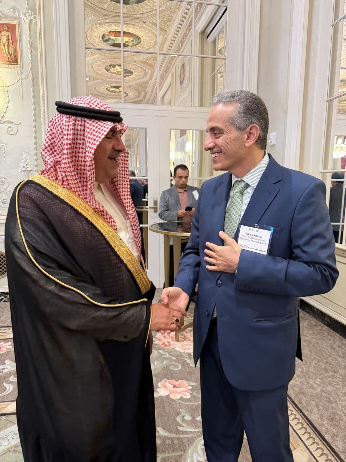 HydroTech President & CEO Tarek Z. Khouri shakes hands with a guest in traditional Saudi dress at the U.S.-Saudi Business Council event in New York.